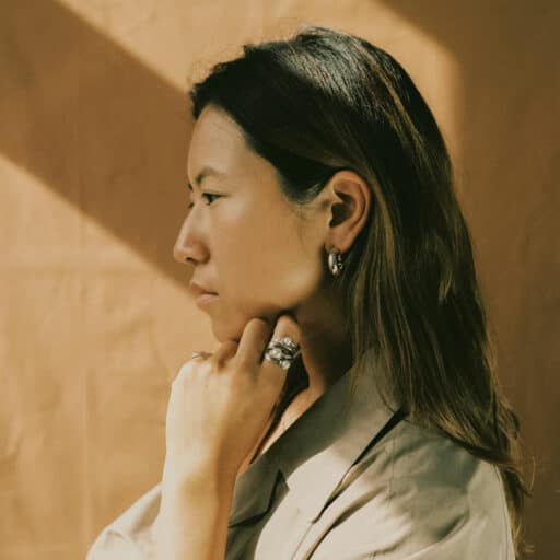 Profile of a woman with silver jewelry